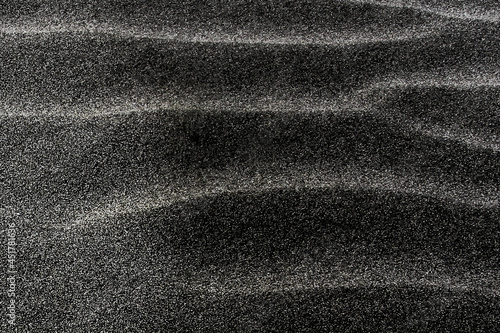 Photography Closeup of the gray sand on the beach