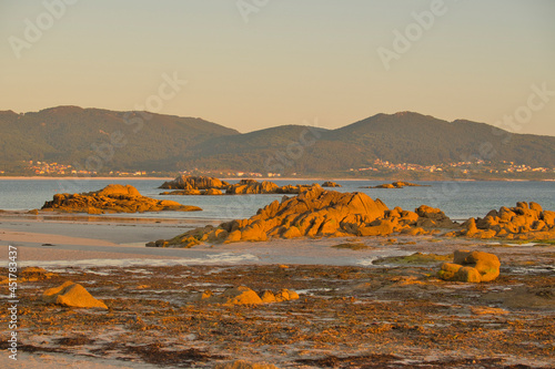 Playa de Caldebarcos al atardecer en la hora dorada, Galicia, provincia de A Coruña, España. photo