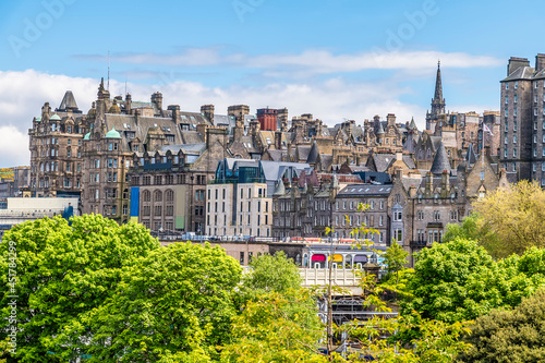 A view from Princes Street Gardens towards the buildings in the lower part of the Royal Mile in Edinburgh, Scotland on a summers day