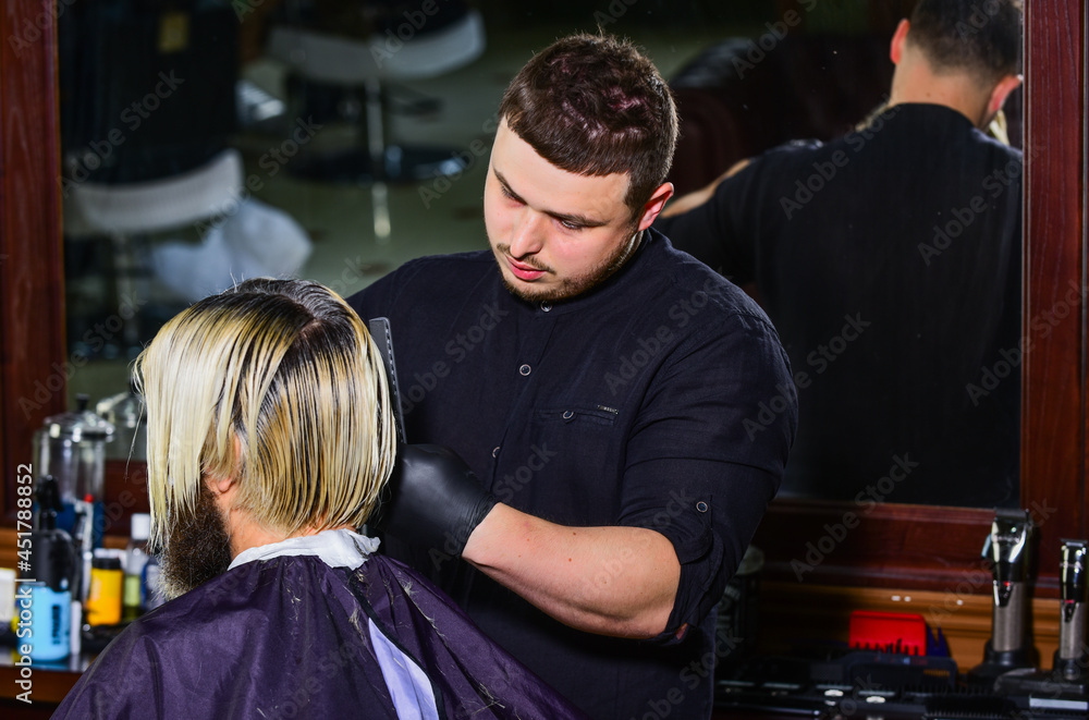 his perfect style. brutal bearded man at hairdresser salon. hair cut and care. new stylish haircut.