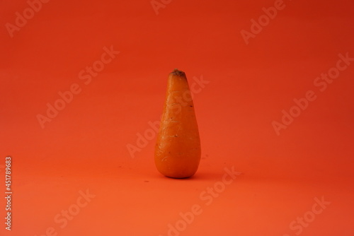 Close up of fresh mini carrots isolated on orange background, Clipping path. tuber plant. Suitable for food business, vegetables, websites, news, health care.