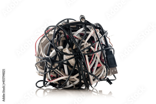Jumbled pile of wires and cables for smartphone isolated on white background photo