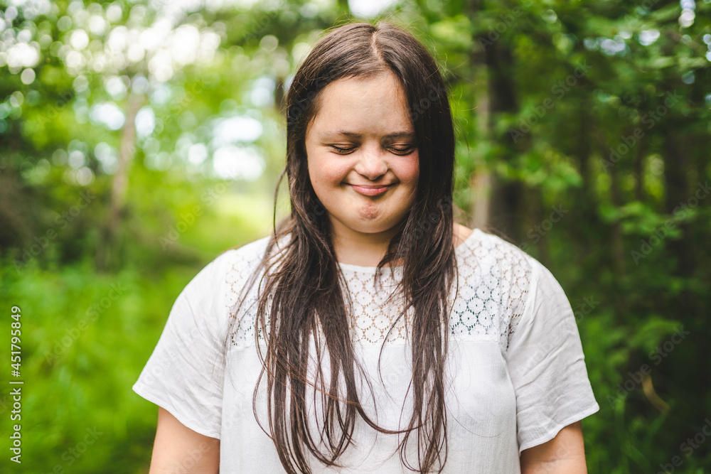 Portrait of trisomy adult outside having fun Portrait of trisomy adult outside having fun
