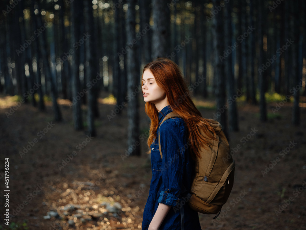 woman walking in the woods backpack travel tourism adventure woman walking in the woods backpack travel tourism adventure