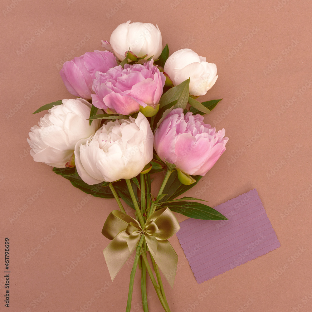 Bouquet of pink and white peonies close-up with copy space for design.