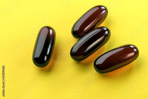 Vitamins in brown gelatin capsule