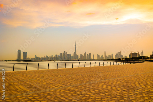 Canvas Print Stunning view of Dubai city skyline at sunset with a colorful sky