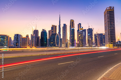 Beautiful view of Dubai city skyscrapers or skyline captured from Marasi Drive at Business Bay District, Dubai, UAE. photo