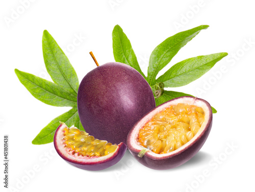 Delicious ripe passion fruits and green leaves on white background