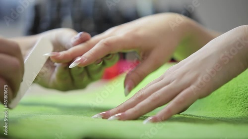 Wallpaper Mural A professional master makes a manicure for a young girl. So that a woman's hands are always beautiful and well-groomed. Torontodigital.ca