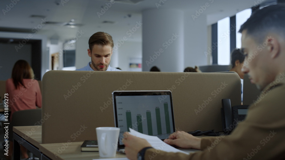 Businessman reading good news on laptop. Male entrepreneur celebrating success Businessman reading good news on laptop. Male entrepreneur celebrating success