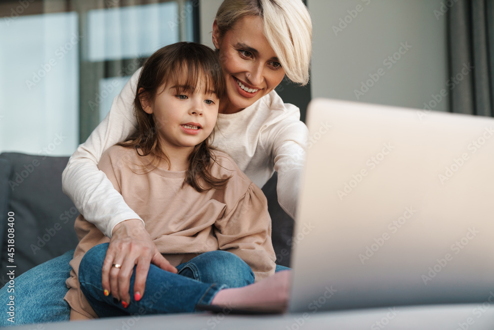 Happy young mother and her little daughter