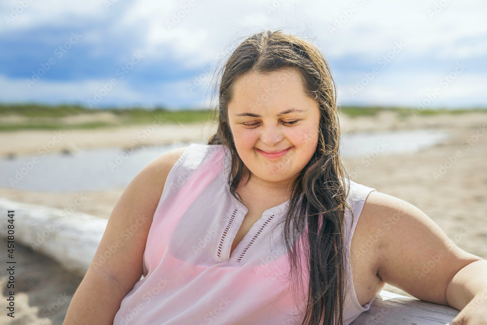 Trisomy 21 woman having fun at the beach Trisomy 21 woman having fun at the beach