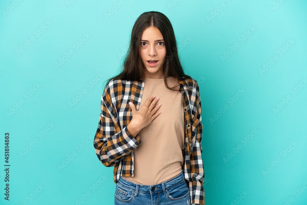 Young French woman isolated on blue background pointing to oneself Young French woman isolated on blue background pointing to oneself