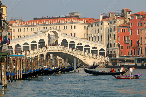 Gondolas, Grand Canal and Rialto bridge in a romantic view of Venice. © Daniele