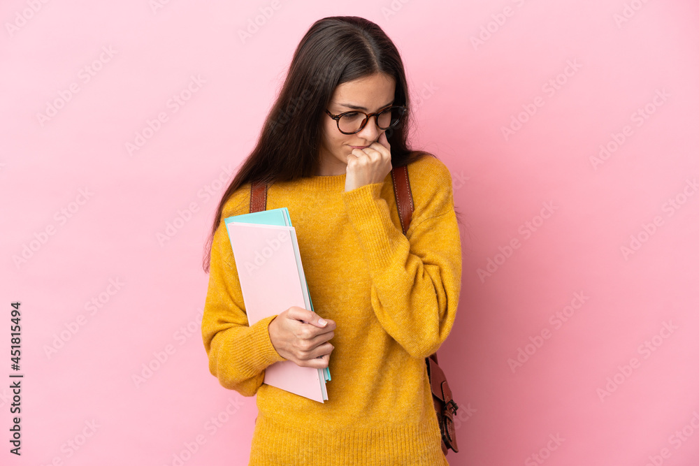 Young student woman over isolated background having doubts Young student woman over isolated background having doubts