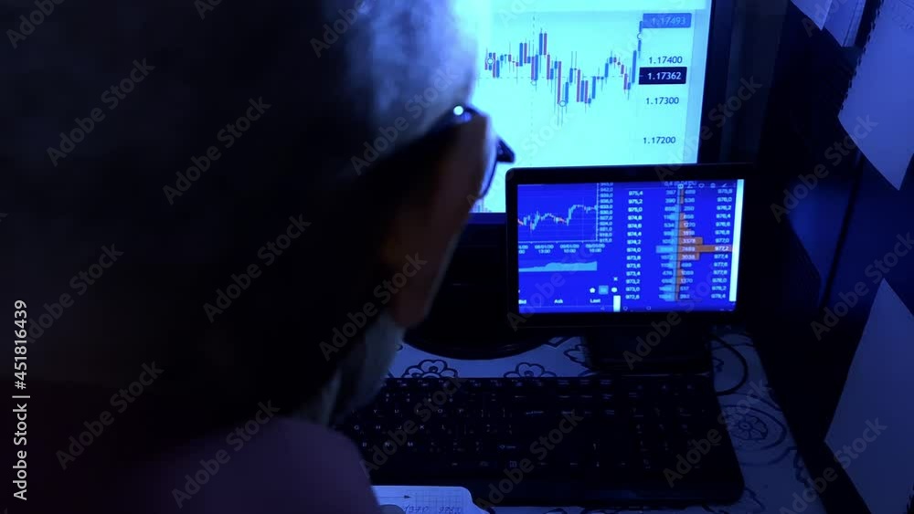 A man uses an online exchange. Online earnings. Crypto. Currency rates. Quotes. A man uses an online exchange. Online earnings. Crypto. Currency rates. Quotes.