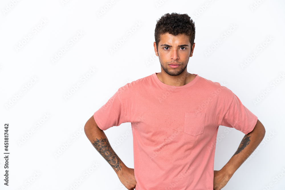 Fototapeta premium Young handsome Brazilian man isolated on white background angry