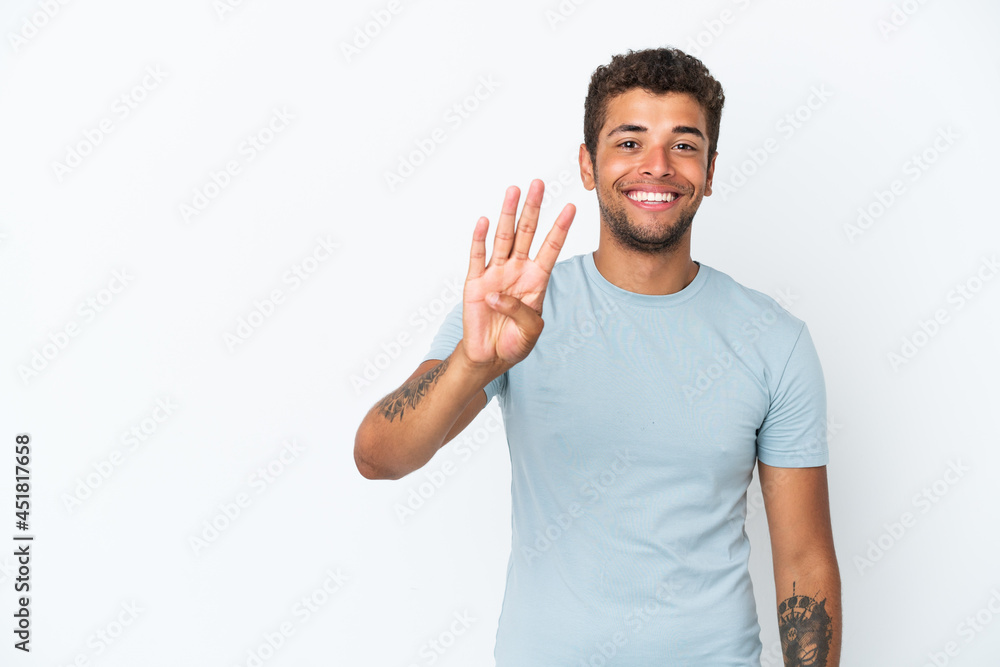 Fototapeta premium Young handsome Brazilian man isolated on white background happy and counting four with fingers