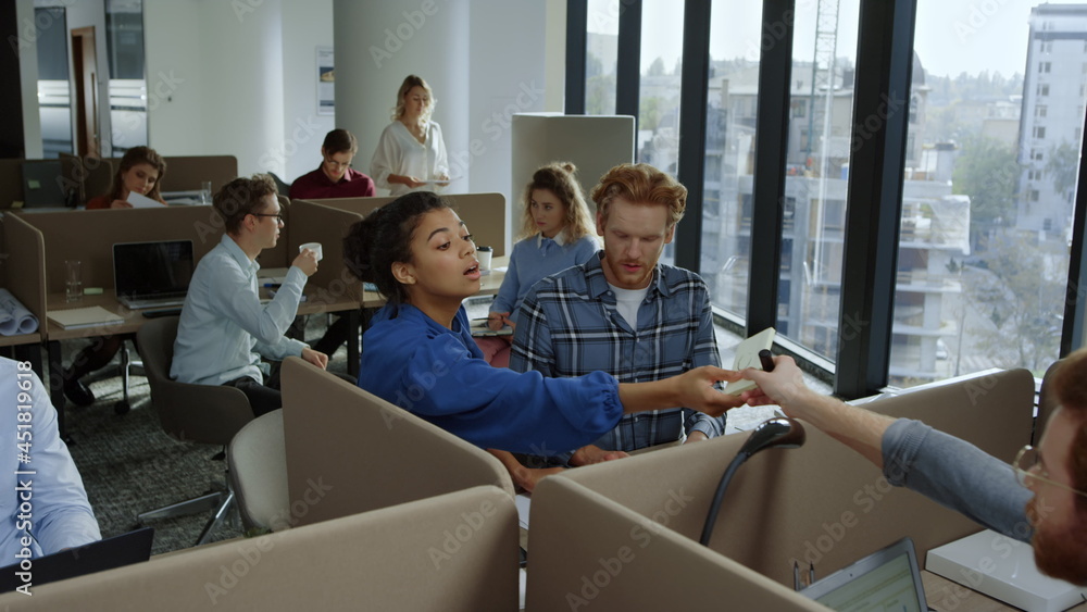 Obraz premium Business team working in office. Employees discussing financial documents