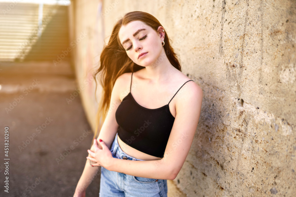Nice and cool teen girl standing portrait on concreate place Nice and cool teen girl standing portrait on concreate place