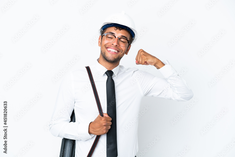 Architect brazilian man with helmet and holding blueprints doing strong gesture Architect brazilian man with helmet and holding blueprints doing strong gesture