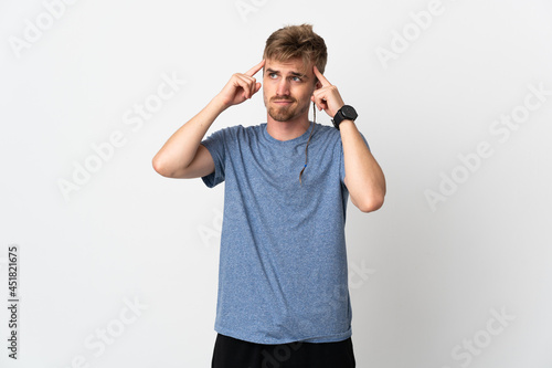 Young handsome man isolated on white background having doubts and thinking
