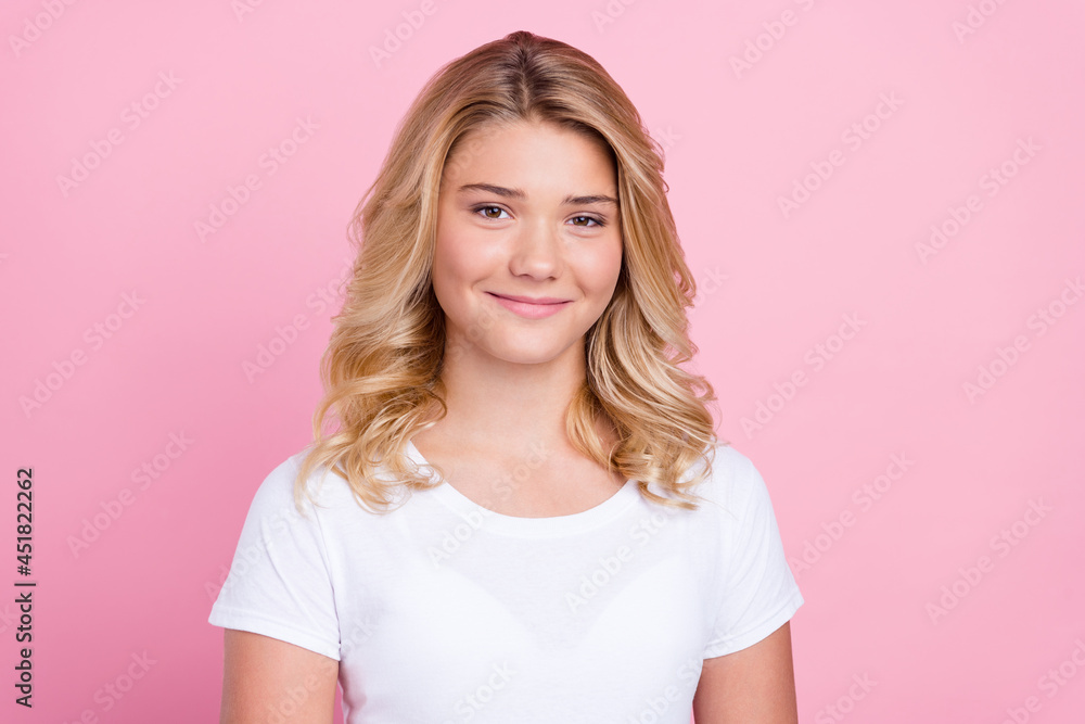 Photo of young pretty girl teenager happy positive smile curly hair isolated over pink color background Photo of young pretty girl teenager happy positive smile curly hair isolated over pink color background
