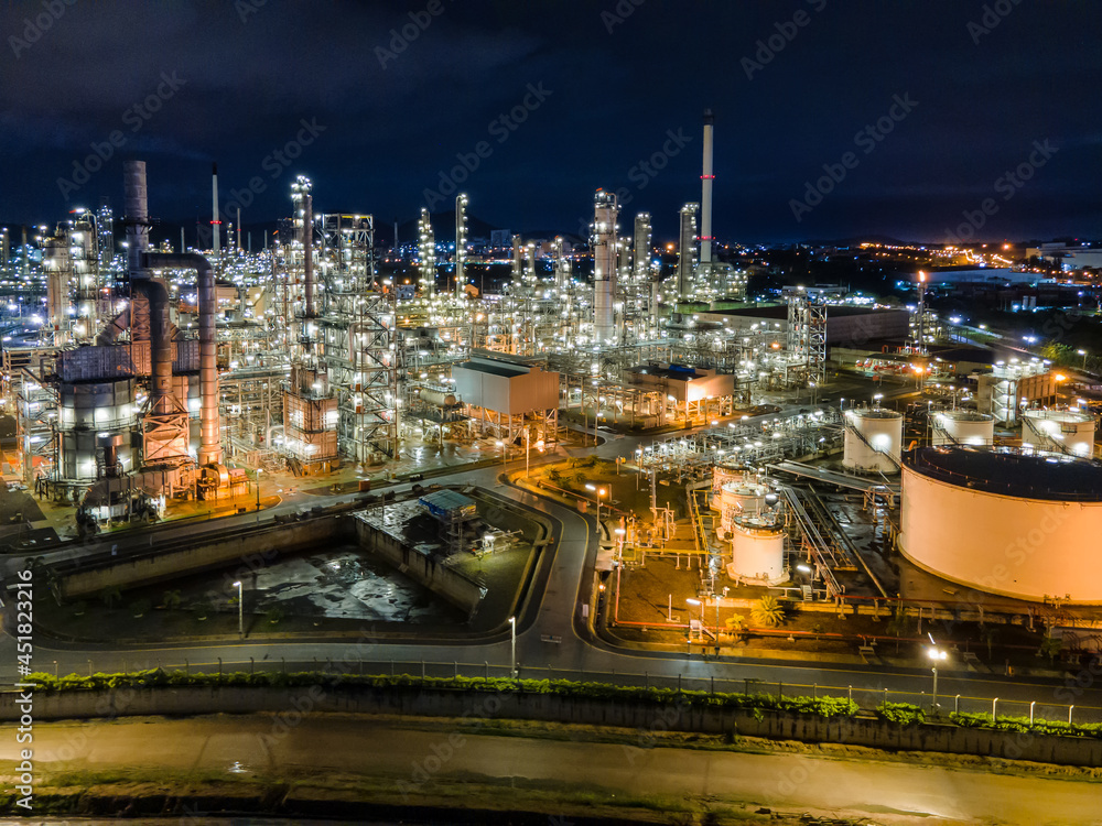Aerial view Oil refinery. Industrial view at oil refinery plant form industry zone with sunrise and cloudy sky. Aerial view Oil refinery. Industrial view at oil refinery plant form industry zone with sunrise and cloudy sky.