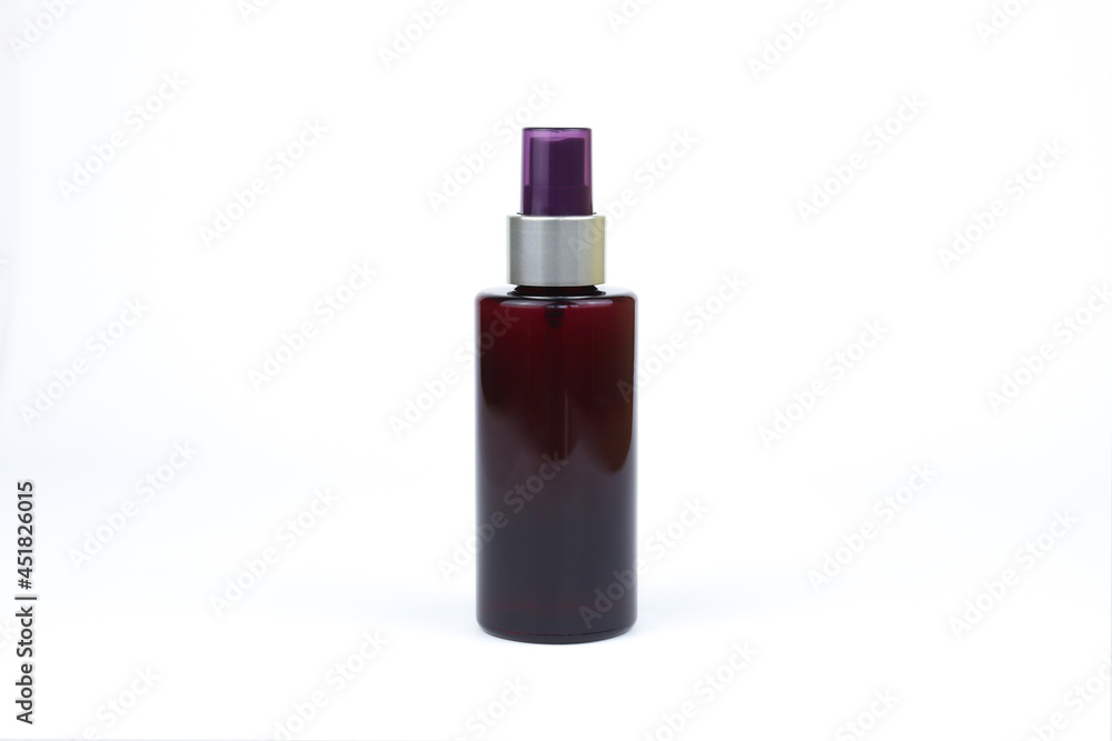 Unbranded brown cosmetic spray bottle isolated on white background. Natural organic spa cosmetics, Spray concept. Body mist, brume corps. Percent sign concept. Mockup, template.