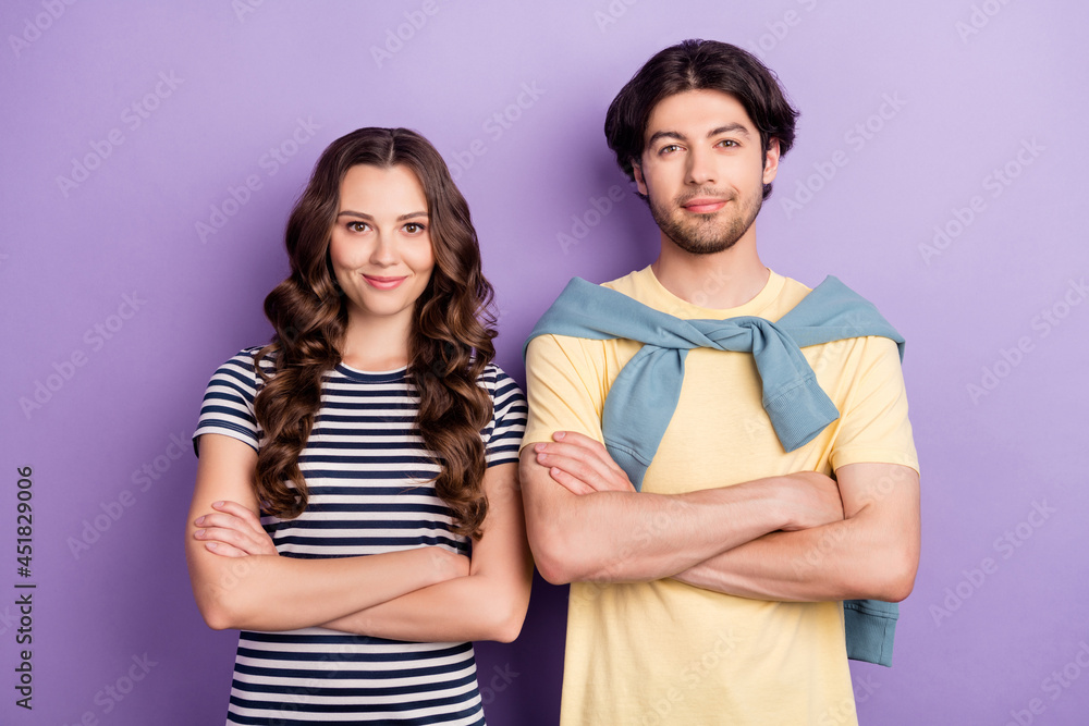 Photo of charming cute lovers dressed casual outfit arms crossed smiling isolated purple color background Photo of charming cute lovers dressed casual outfit arms crossed smiling isolated purple color background