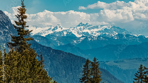 Beautiful alpine summer far view of the famous Grossglockner summit as seen from the Steinplatte summit, Waidring, Tyrol, Austria photo