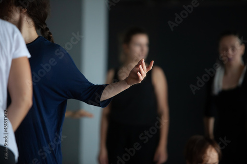 dancer hand gesture move in contemporary improvisation performance intentionally with motion blur ond defocus bokeh