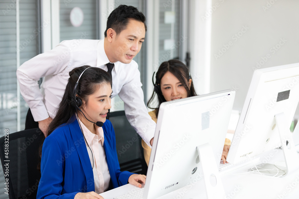 businessman supervisor training and suggesting about work to colleagues at call center service businessman supervisor training and suggesting about work to colleagues at call center service