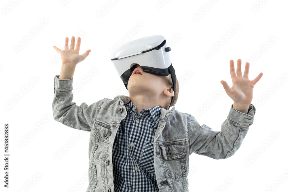 Young boy with virtual reality glasses isolated on white background. A child in emotional excitement wearing 3D glasses. Young boy with virtual reality glasses isolated on white background. A child in emotional excitement wearing 3D glasses.