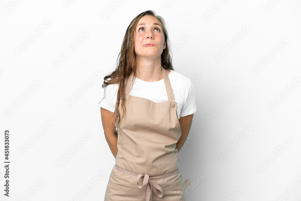Restaurant waiter caucasian woman isolated on white background and looking up Restaurant waiter caucasian woman isolated on white background and looking up