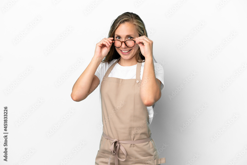 Restaurant waiter caucasian woman isolated on white background with glasses and surprised Restaurant waiter caucasian woman isolated on white background with glasses and surprised