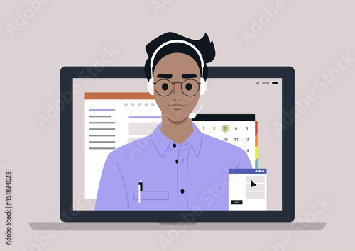 A young male hotline assistant wearing a head set, online customer service info line