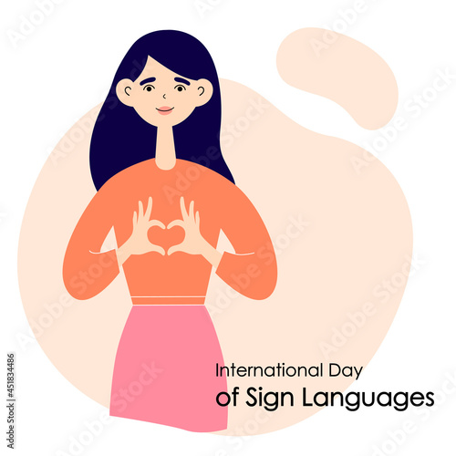The girl shows a heart with her hands. International Day of Sign Languages. Flat vector illustration
