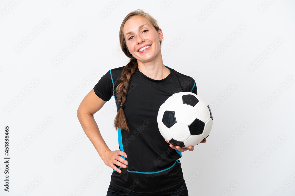 Young football player woman isolated on white background posing with arms at hip and smiling