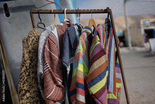 Store selling traditional maroccan cultural cloth, carpetand dishes made from the locals photo