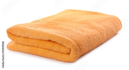 Folded orange beach towel isolated on white