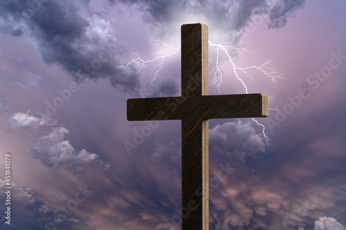 Religious cross against moody sky