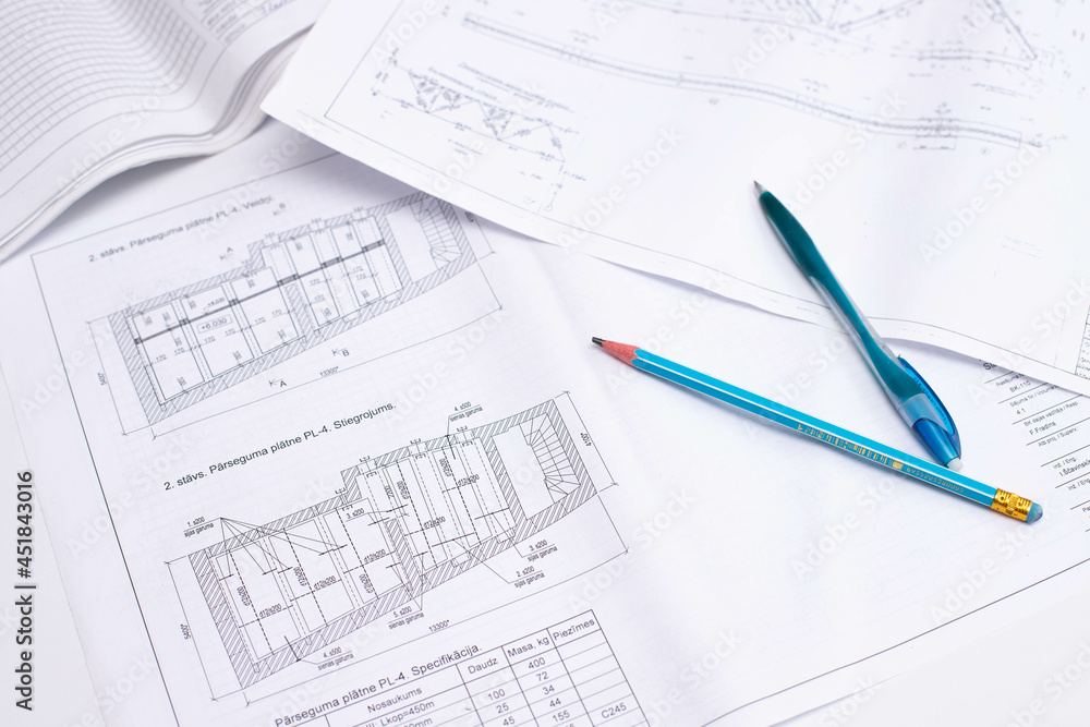 drawings of a construction engineer on a sheet of paper drawings of a construction engineer on a sheet of paper