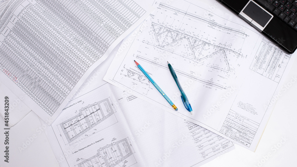drawings of a construction engineer on a sheet of paper drawings of a construction engineer on a sheet of paper