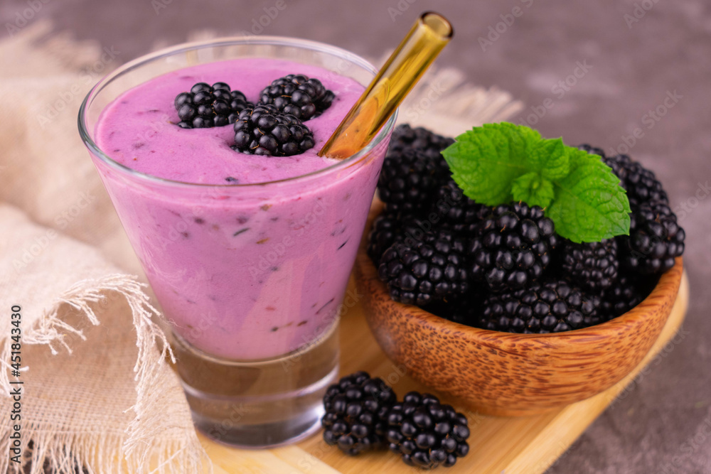 Blackberry smoothie.
Close-up view from the top. Blackberry smoothie.
Close-up view from the top.