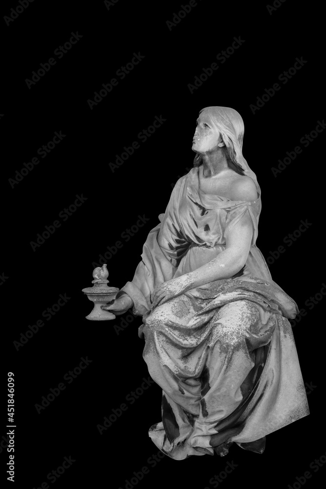 Ancient stone statue of sad and desperate woman on tomb as a symbol of death and the end of human life. Selective focus. Vertical image.