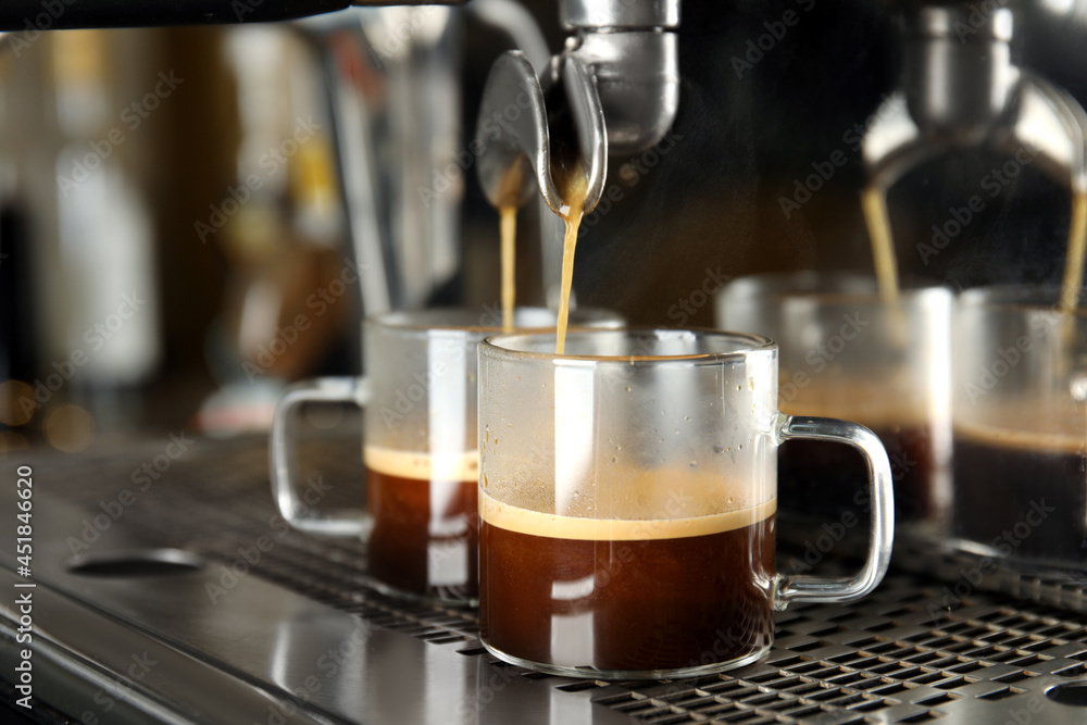 Fototapeta premium Making fresh aromatic espresso using professional coffee machine