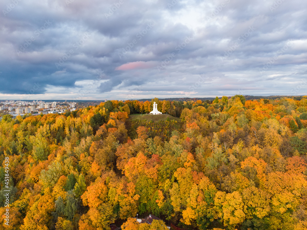 Aerial view of the Three Crosses monument overlooking Vilnius Old Town on sunset. Vilnius landscape from the Hill of Three Crosses, Lithuania