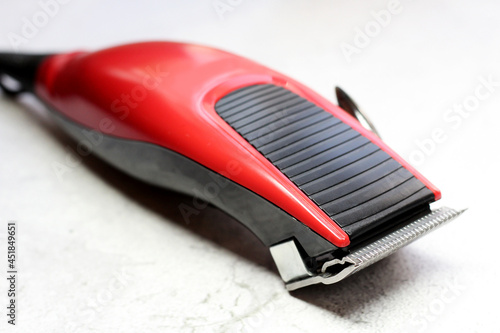 Electric hair clipper, a device for a hairdresser, red color object